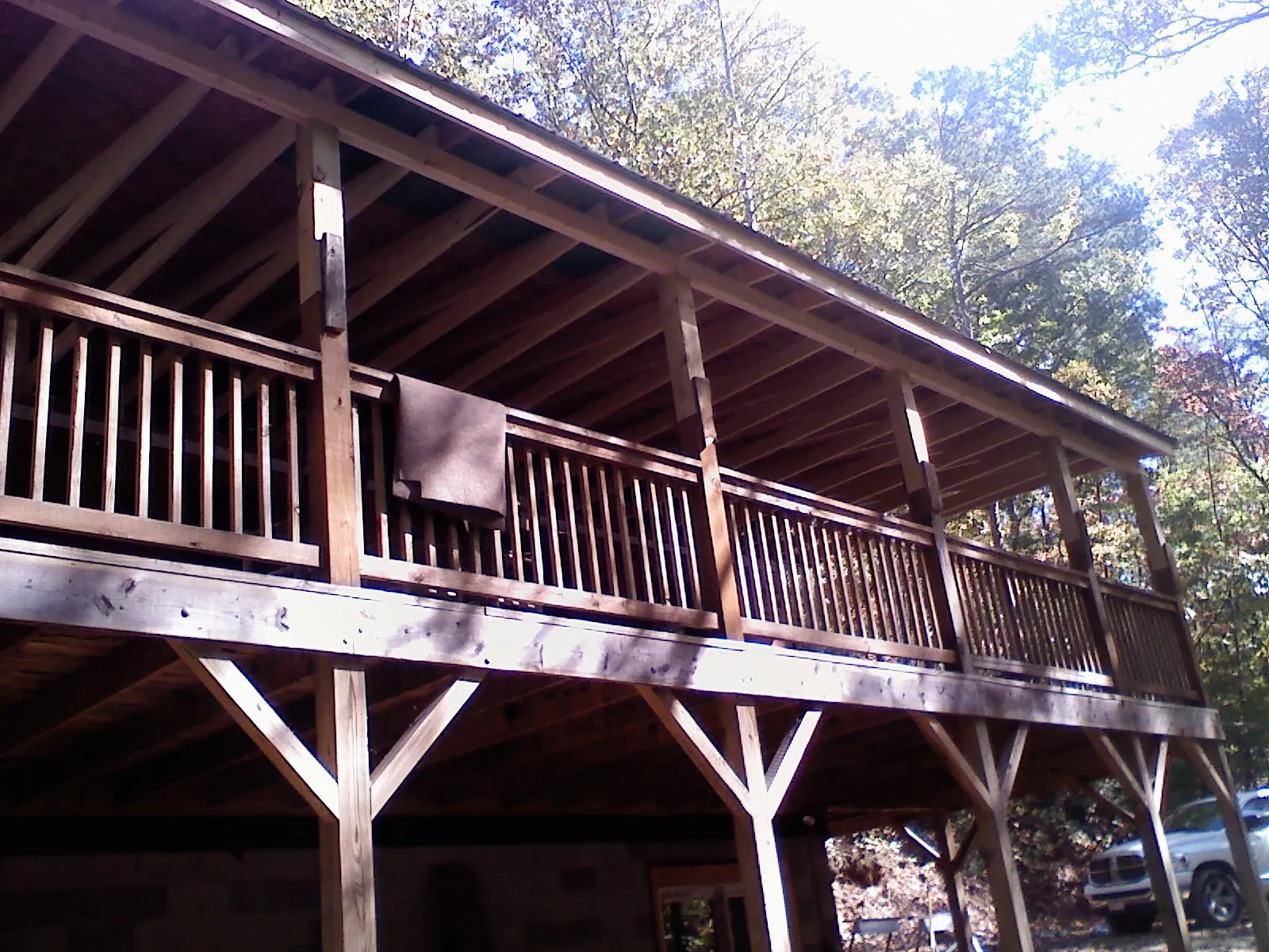 Timber framing under a new elevated porch and deck — Roof Leak Repair in Cortland by Roofing Brothers